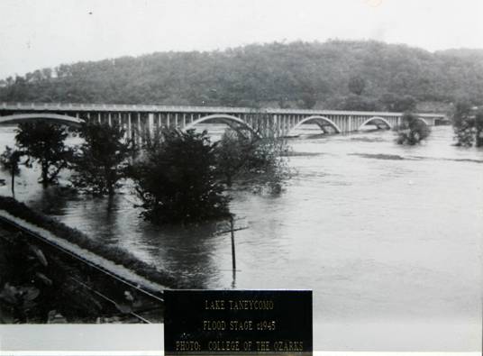 Taneycomo Arch Bridge at Flood stage in 1945