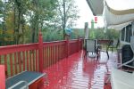 Deck on the back of the house overlooking the property